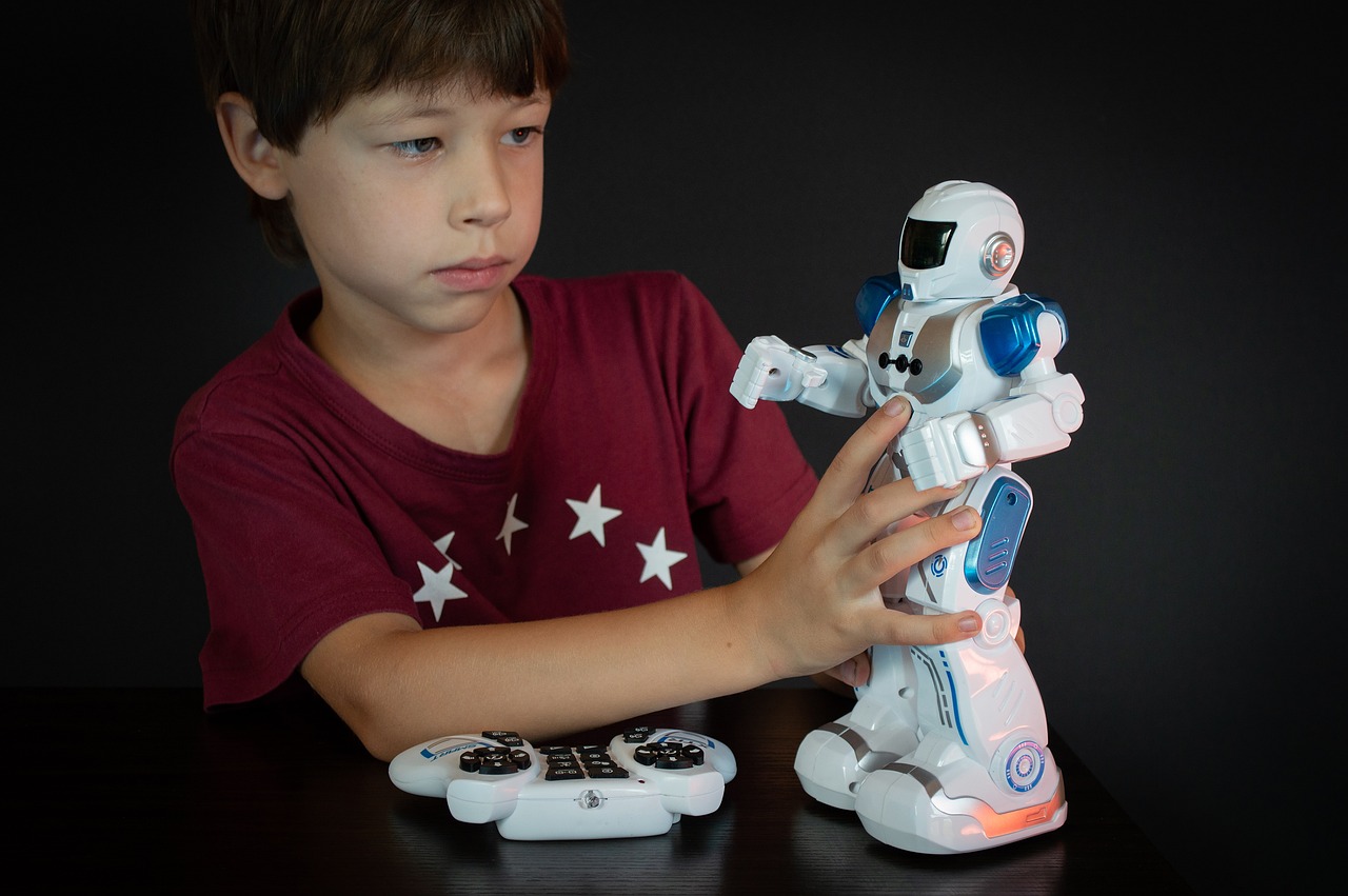 a boy playing with a robot toy